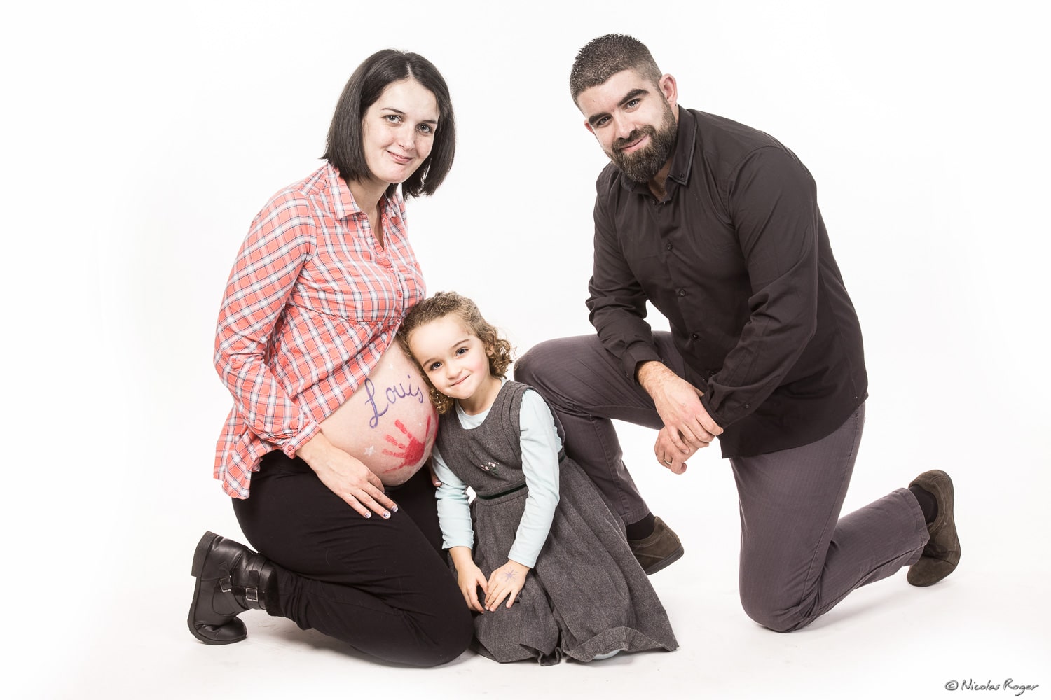 Photographie d&rsquo;une famille avec leur futur enfant